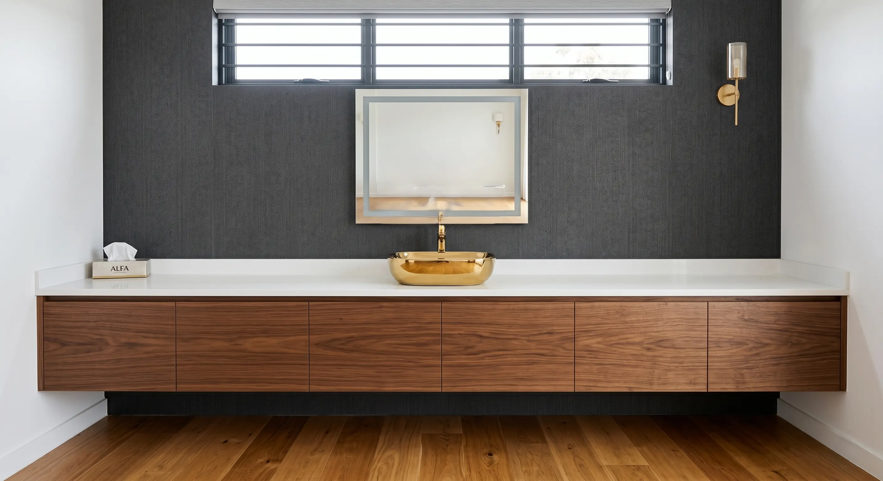 Modern kitchen space with elegant lighting and wood finishes